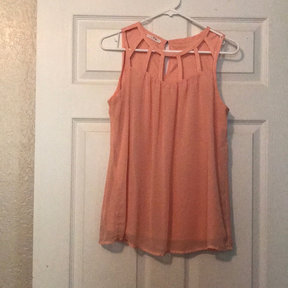 Light coral sleeveless blouse